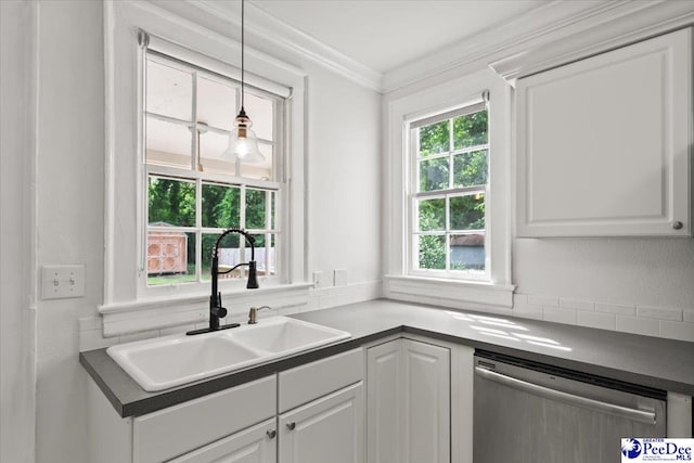 312 Greene St, Cheraw, SC 29520 - kitchen with stainless steel dishwasher, a sink, ornamental molding, white cabinets, and decorative light fixtures