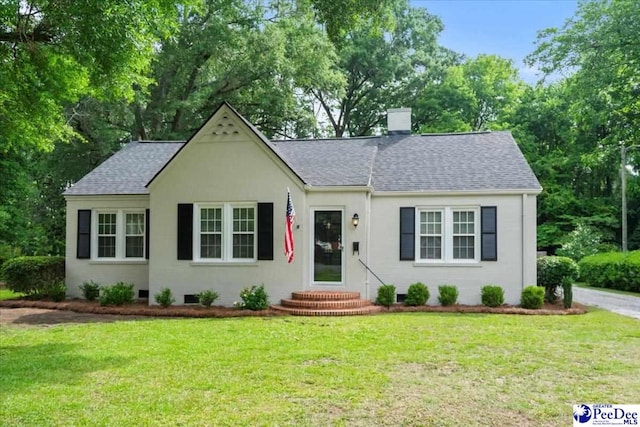 312 Greene St, Cheraw, SC 29520 - view of front facade with roof with shingles, a front yard, and crawl space