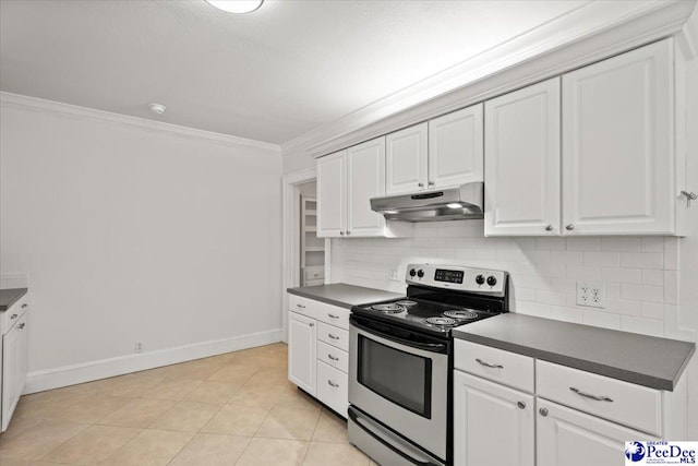 312 Greene St, Cheraw, SC 29520 - kitchen with stainless steel range with electric stovetop, under cabinet range hood, dark countertops, ornamental molding, and baseboards
