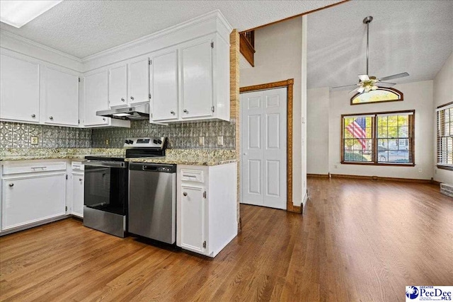 kitchen featuring a ceiling fan, white cabinets, under cabinet range hood, and stainless steel appliances