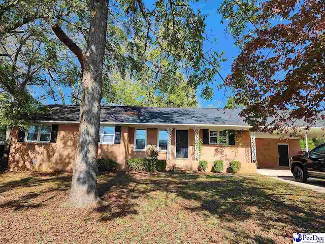 ranch-style home with a front lawn