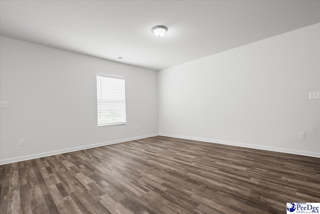 3229 Winding Way Dr, Florence, SC 29506 - unfurnished room with dark wood finished floors and baseboards