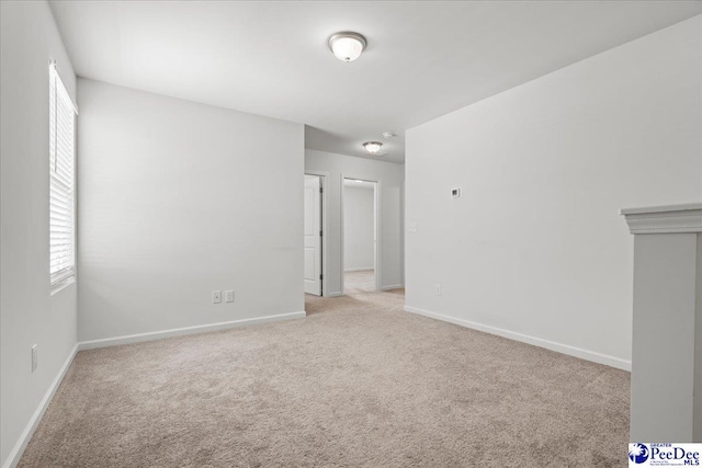3229 Winding Way Dr, Florence, SC 29506 - spare room with light colored carpet and baseboards