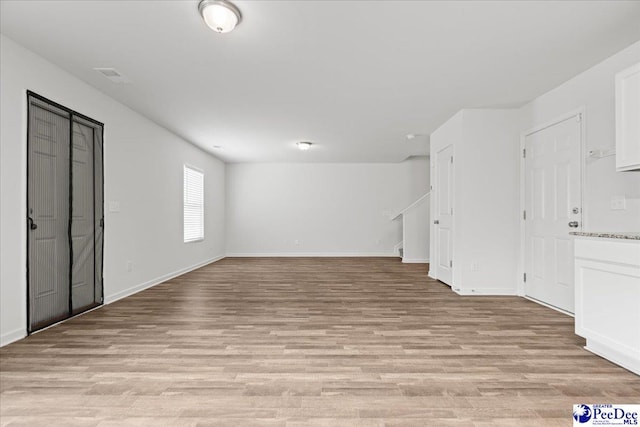 3229 Winding Way Dr, Florence, SC 29506 - below grade area with light wood-style floors and baseboards
