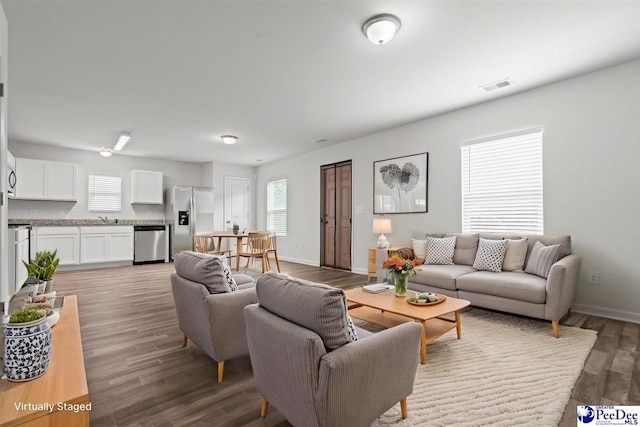 3229 Winding Way Dr, Florence, SC 29506 - living room featuring light wood-style flooring and baseboards