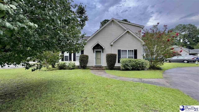 view of front of property with a front lawn