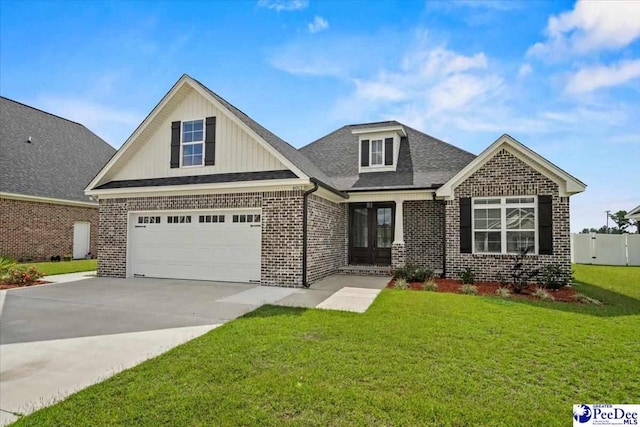 craftsman house with a garage and a front lawn