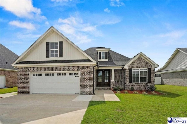 view of front of property with a garage and a front lawn