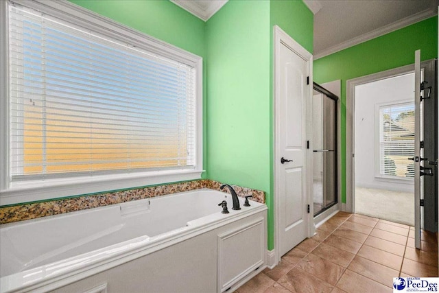 bathroom featuring tile patterned flooring, crown molding, and separate shower and tub