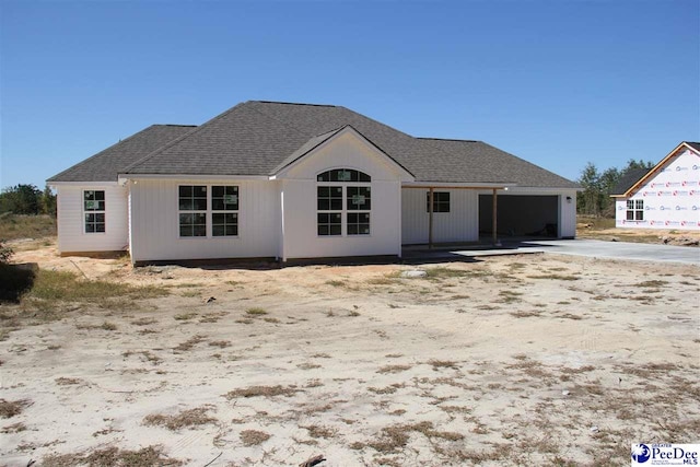 back of house with a garage