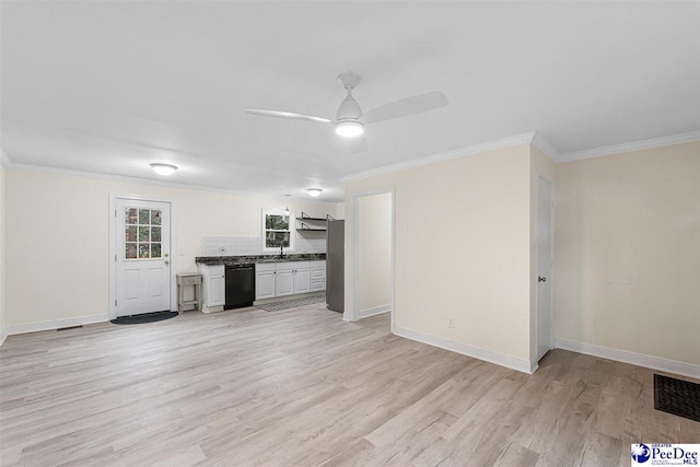 kitchen with crown molding, dishwasher, light wood-type flooring, and decorative backsplash