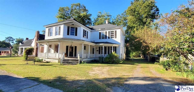 view of front of house featuring a porch and a front lawn