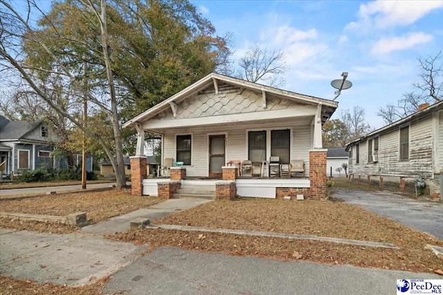 bungalow-style home with covered porch