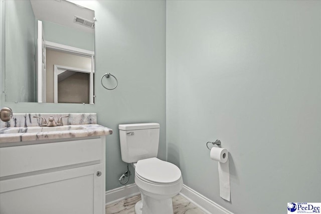 bathroom featuring marble finish floor, visible vents, toilet, vanity, and baseboards