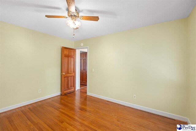 3116 Kenfield Ln, Florence, SC 29505 - empty room featuring baseboards, light wood-style flooring, and ceiling fan