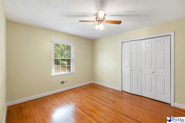 3116 Kenfield Ln, Florence, SC 29505 - unfurnished bedroom featuring baseboards, light wood-style flooring, a closet, and a ceiling fan