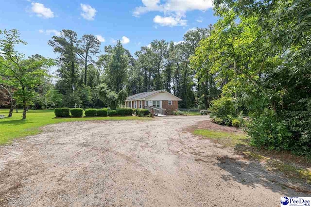3116 Kenfield Ln, Florence, SC 29505 - ranch-style house featuring a front lawn and dirt driveway