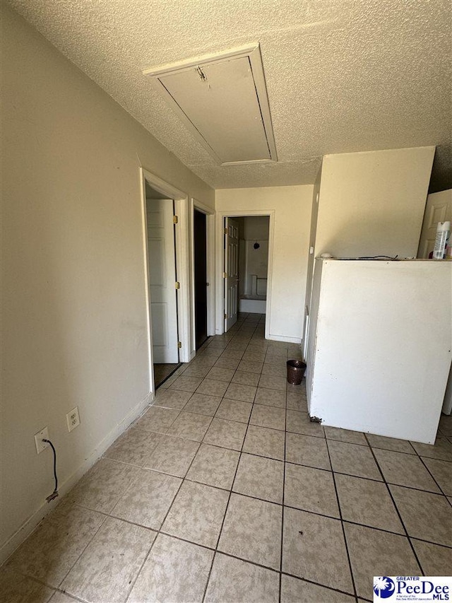 interior space featuring a textured ceiling