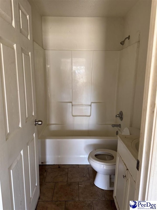 full bathroom with vanity, tile patterned floors, shower / bathtub combination, and toilet