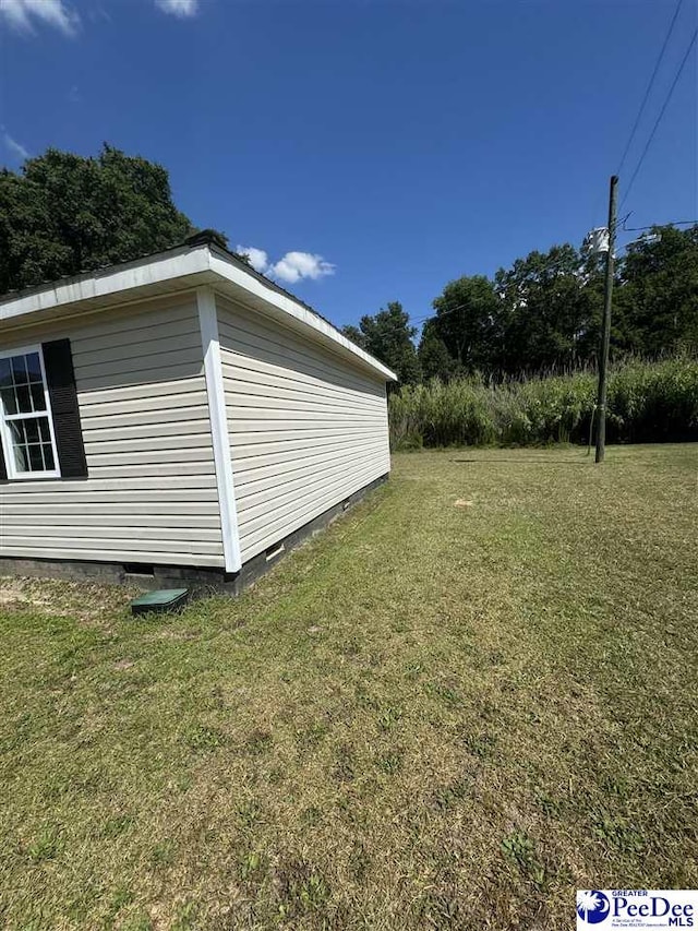 view of property exterior with a lawn