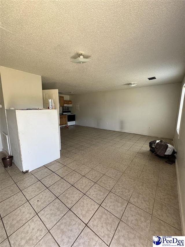 empty room with a textured ceiling