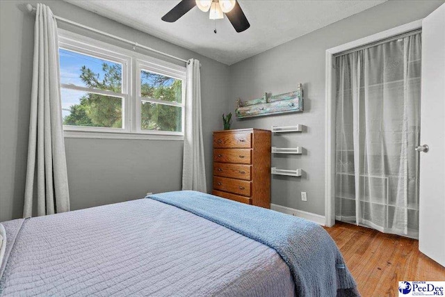 2217 W Mccown Dr, Florence, SC 29501 - bedroom featuring wood finished floors, baseboards, and ceiling fan