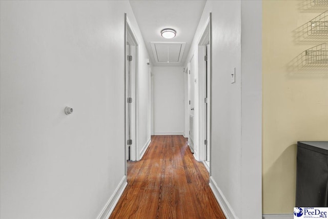 2217 W Mccown Dr, Florence, SC 29501 - hall with attic access, wood finished floors, and baseboards