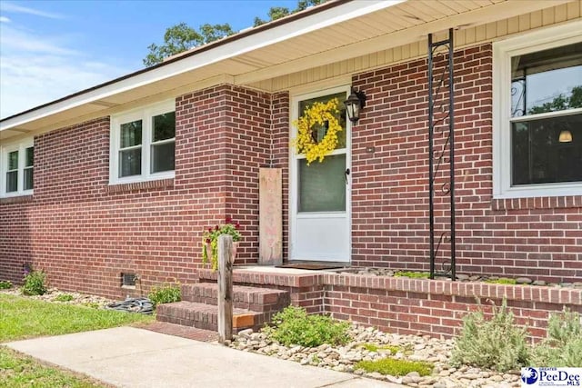 2217 W Mccown Dr, Florence, SC 29501 - view of exterior entry with brick siding and crawl space