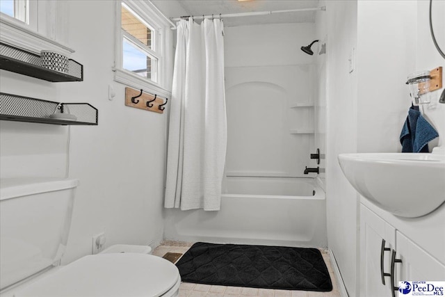 2217 W Mccown Dr, Florence, SC 29501 - full bath featuring toilet, shower / bathtub combination with curtain, vanity, and baseboards