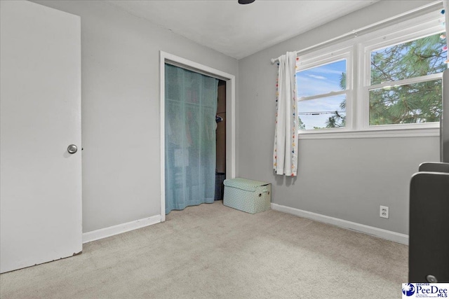 2217 W Mccown Dr, Florence, SC 29501 - unfurnished bedroom featuring carpet floors, baseboards, and a closet