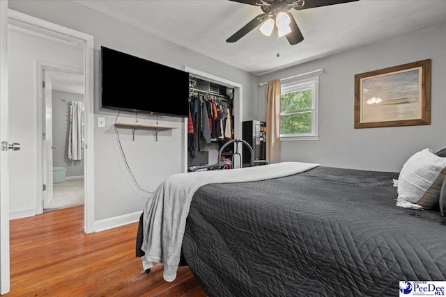 2217 W Mccown Dr, Florence, SC 29501 - bedroom featuring wood finished floors, a closet, ceiling fan, and baseboards