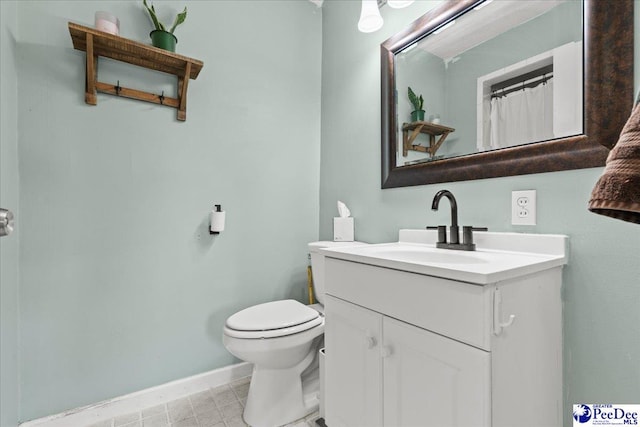 2217 W Mccown Dr, Florence, SC 29501 - full bathroom with vanity, baseboards, and toilet