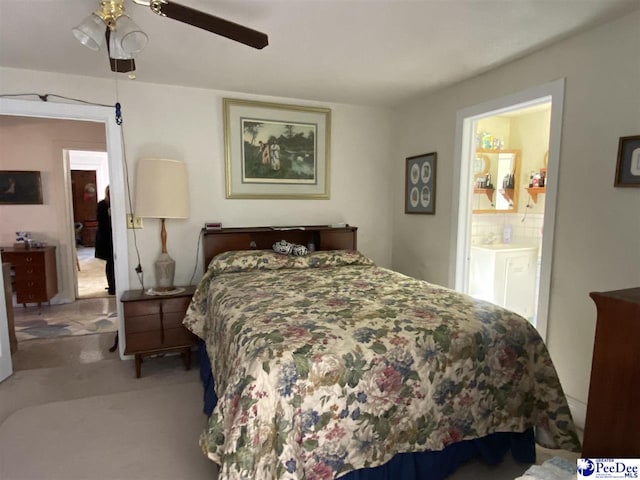 bedroom with ceiling fan and ensuite bathroom