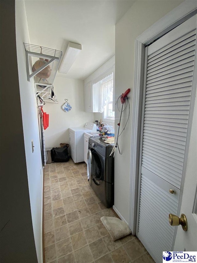 laundry area featuring washing machine and dryer