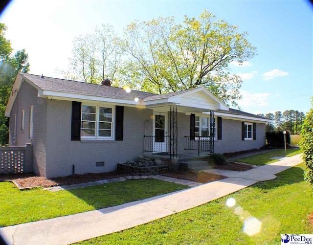 single story home featuring covered porch, brick siding, crawl space, and a front lawn