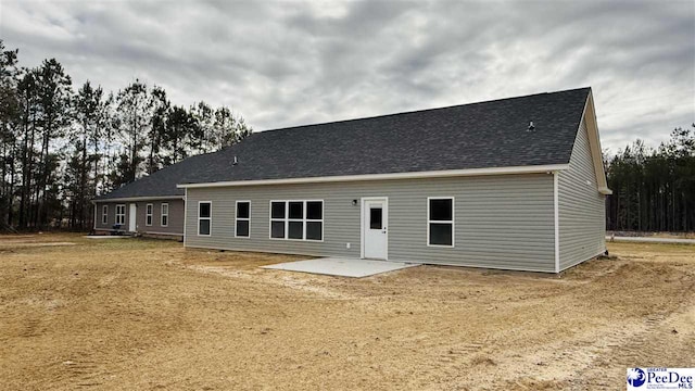 rear view of house with a patio