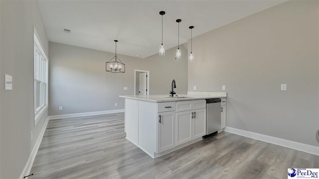 kitchen featuring decorative light fixtures, dishwasher, sink, white cabinets, and light hardwood / wood-style floors