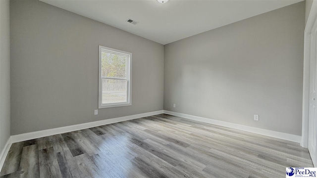 empty room with light wood-type flooring