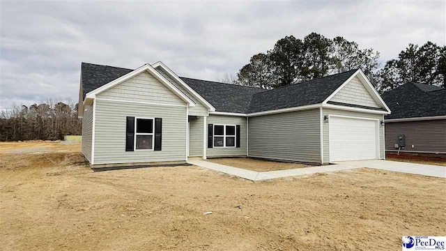 ranch-style house featuring a garage