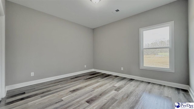 empty room with light wood-type flooring