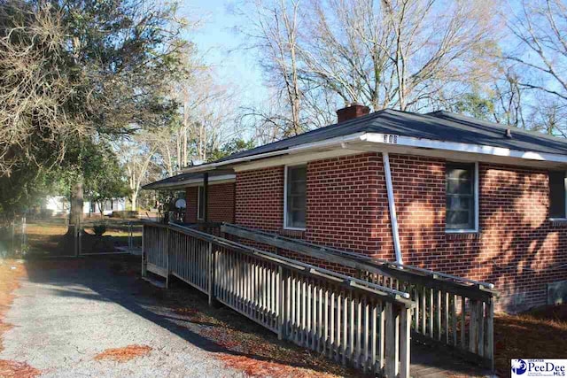 view of home's exterior featuring a deck