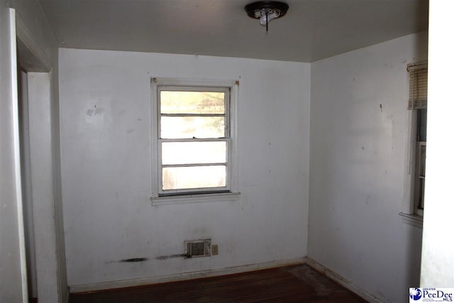 unfurnished room featuring dark hardwood / wood-style flooring