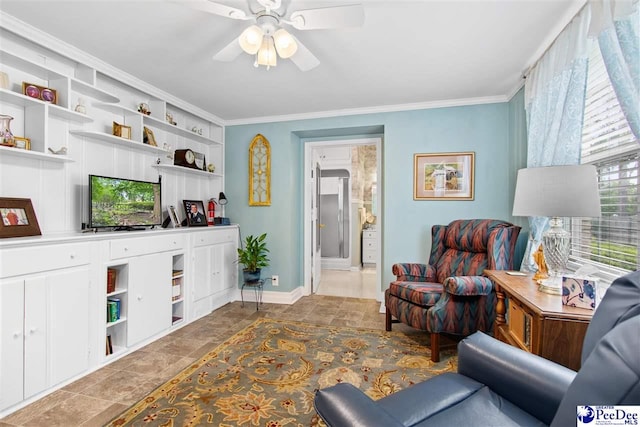 living room featuring ceiling fan and ornamental molding