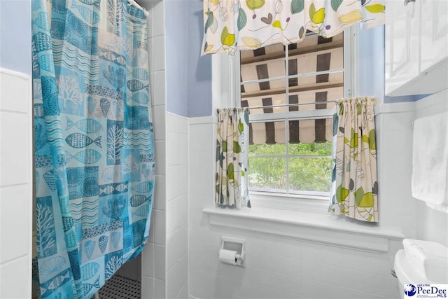 bathroom with a shower with curtain