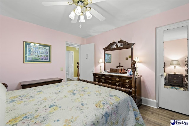 bedroom featuring wood-type flooring and ceiling fan