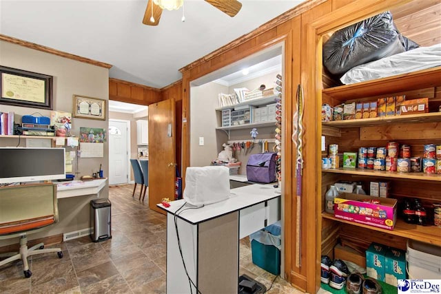 home office featuring crown molding, built in desk, and ceiling fan