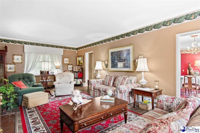 living room featuring an inviting chandelier and hardwood / wood-style flooring