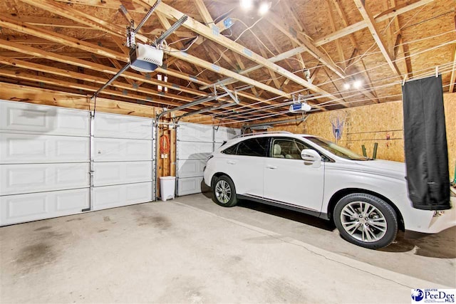 garage featuring a garage door opener