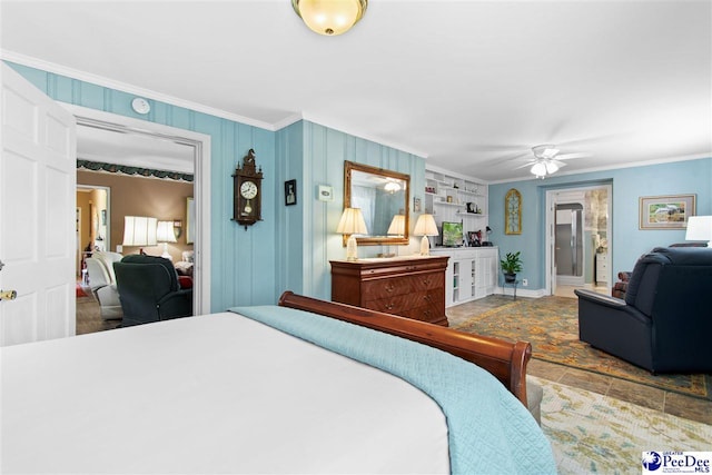 bedroom featuring ornamental molding and ensuite bathroom