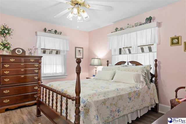 bedroom with hardwood / wood-style flooring and ceiling fan